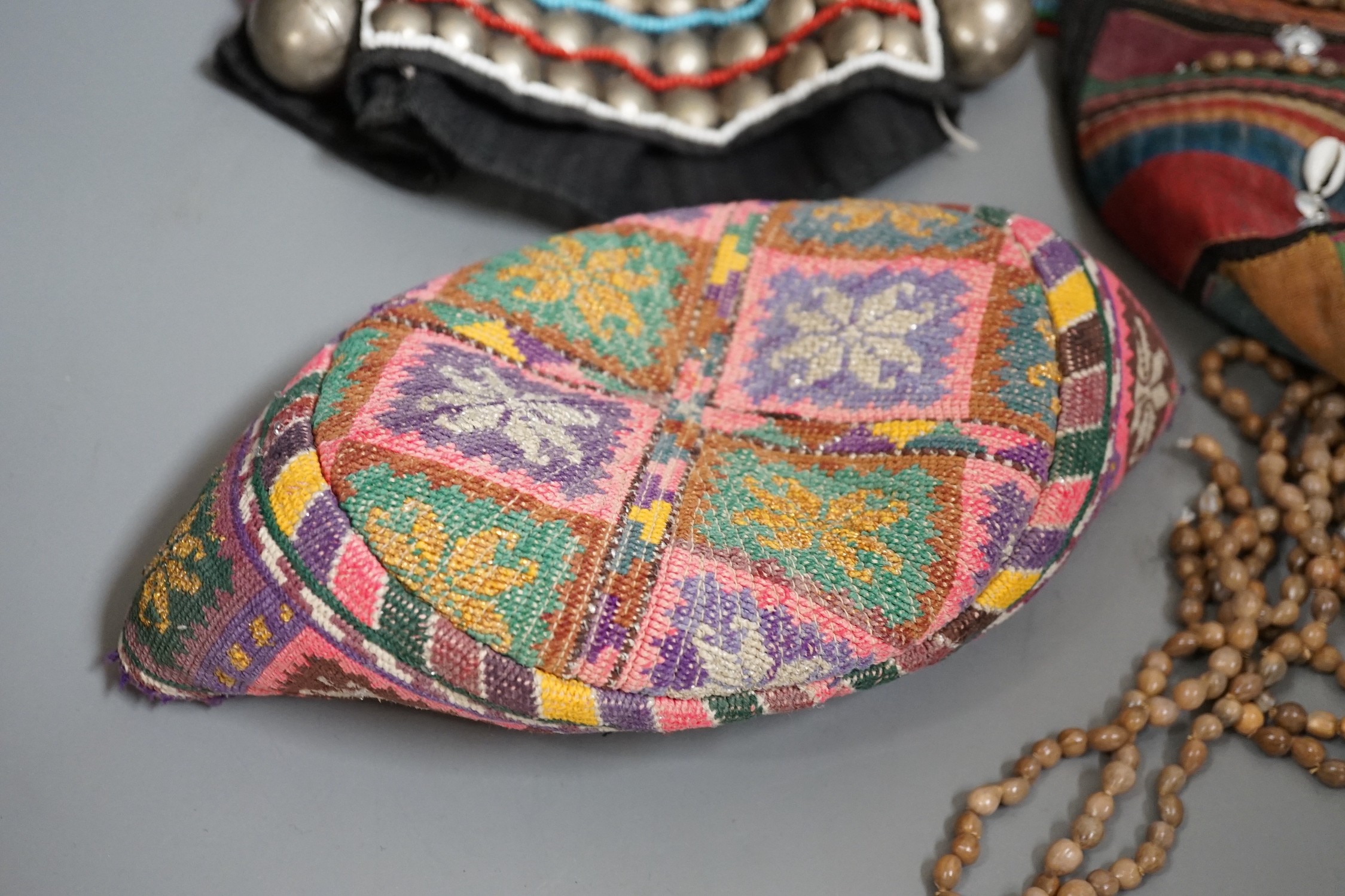 Two Thailand headdresses and an Afghan headdress